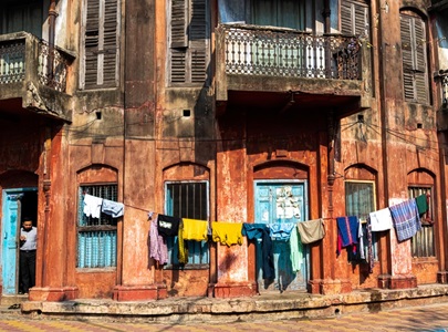 India-Kolkata-Building-Laundry--Man-In-Doorway