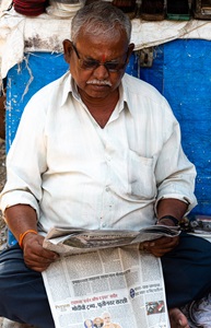 India-Mumbai-Man-Reading-Newspaper-2