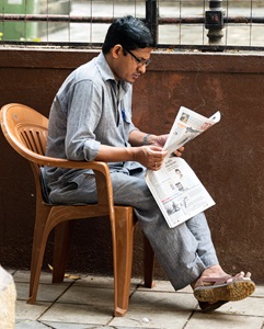 India-Mumbai-Man-Reading-Newspaper